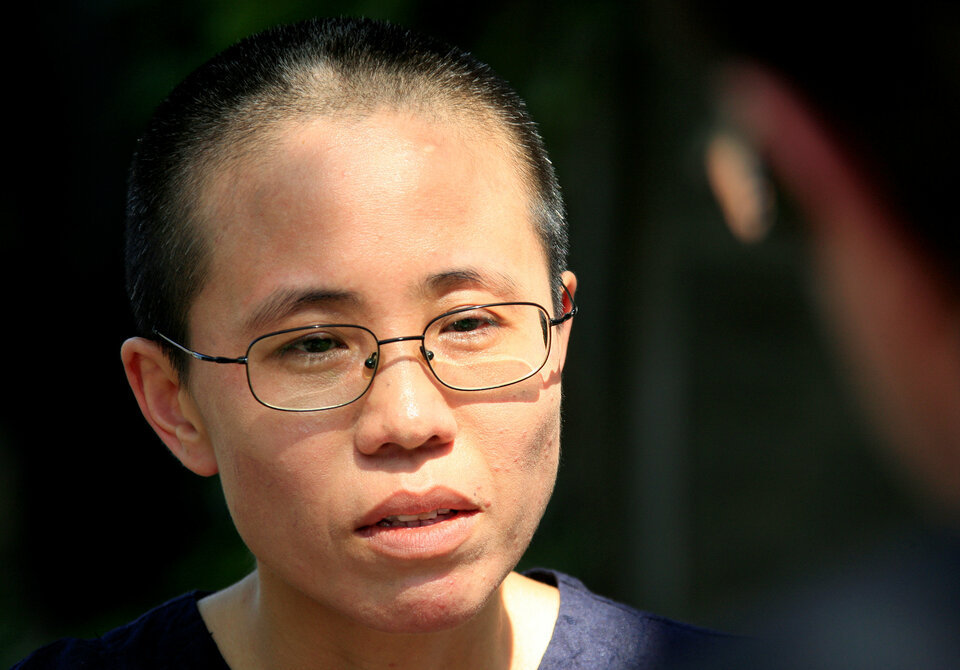 Liu Xia, wife of veteran Chinese pro-democracy activist Liu Xiaobo, listens to a question during an interview in Beijing June 24, 2009.  (Reuters Photo/David Gray)