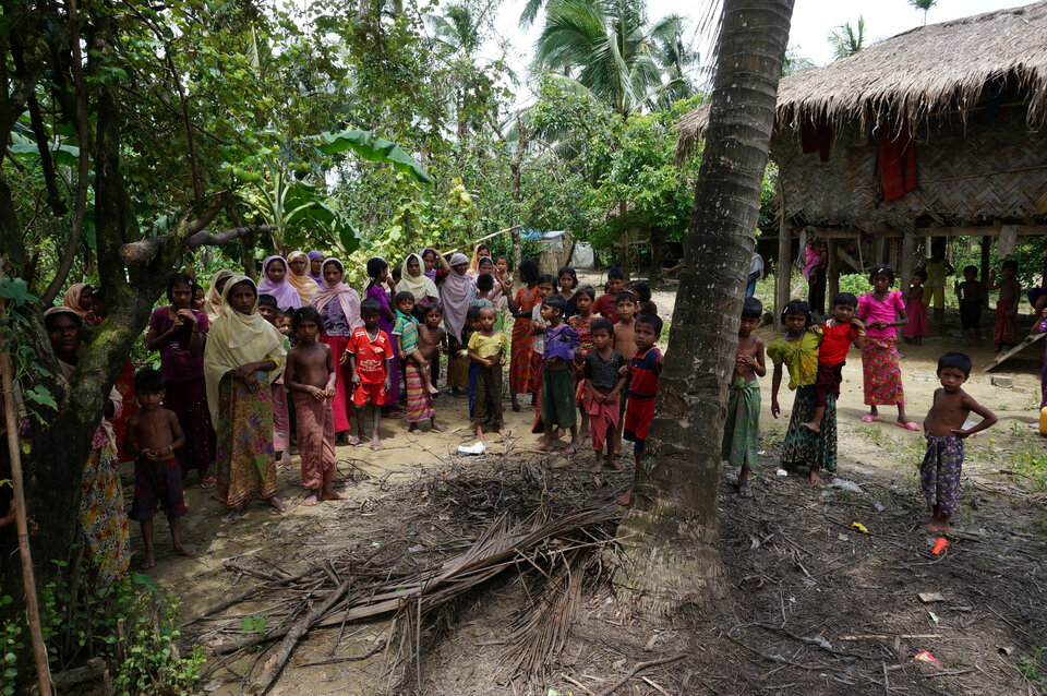 Rohingya villagers watch as journalists visit Maung Hna Ma village in the Buthidaung township, northern Rakhine state, Myanmar, on July 14. (Reuters Photo/Simon Lewis)