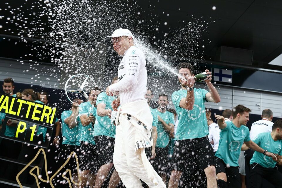 Valtteri Bottas celebrates his win with teammates. (Photo courtesy of Twitter/Mercedes AMG F1)