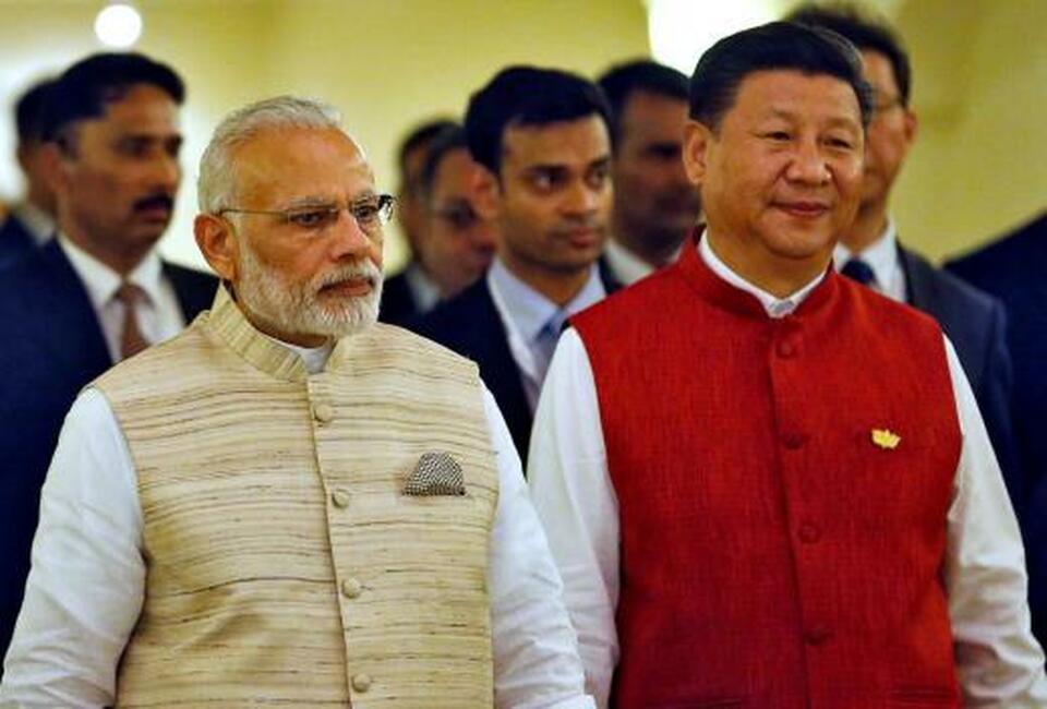 Indian Prime Minister Narendra Modi, left, and Chinese President Xi Jinping  arrive for a photo opportunity ahead of BRICS (Brazil, Russia, India, China and South Africa) Summit in Benaulim in the western state of Goa in India on Oct. 15, 2016. (Reuters Photo/Danish Siddiqui)