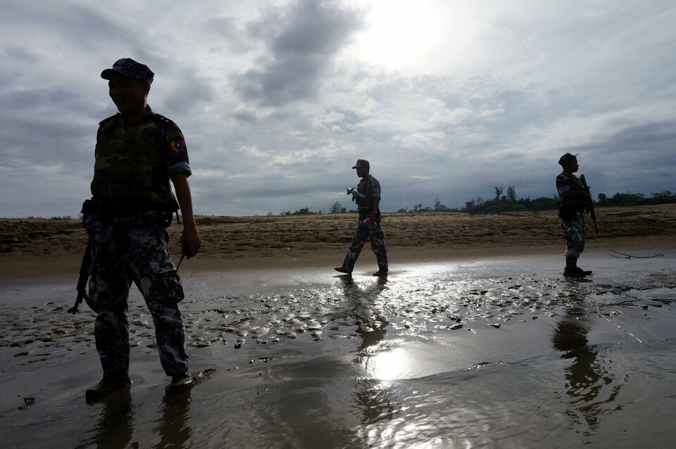 A Myanmar border guard police officers stand guard in Buthidaung, northern Rakhine state. (Reuters Photo/Simon Lewis)