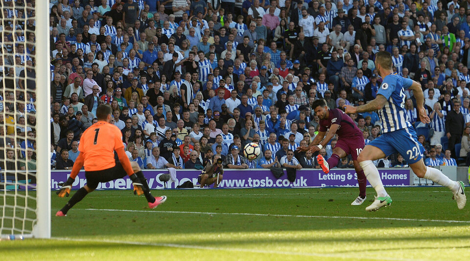 Manchester City's Sergio Aguero scores their first goal on Saturday (12/08)l. (Reuters Photo/Hannah McKay)