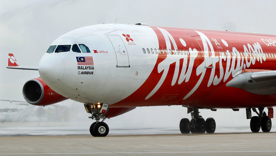 AirAsia X Bhd said it swung into a net loss in its third quarter from a year earlier, blaming higher costs and lower unit revenues particularly in its main markets of Malaysia and Thailand. (Reuters Photo/Charles Platiau)