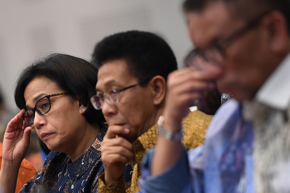 From left, Finance Minister Sri Mulyani Indrawati, Treasury Director General Marwanto Harjowiryono and Tax Director General Ken Dwijugiasteadi participating in a meeting with the budget committee at the House of Representatives during July this year. (Antara Photo/Sigid Kurniawan)