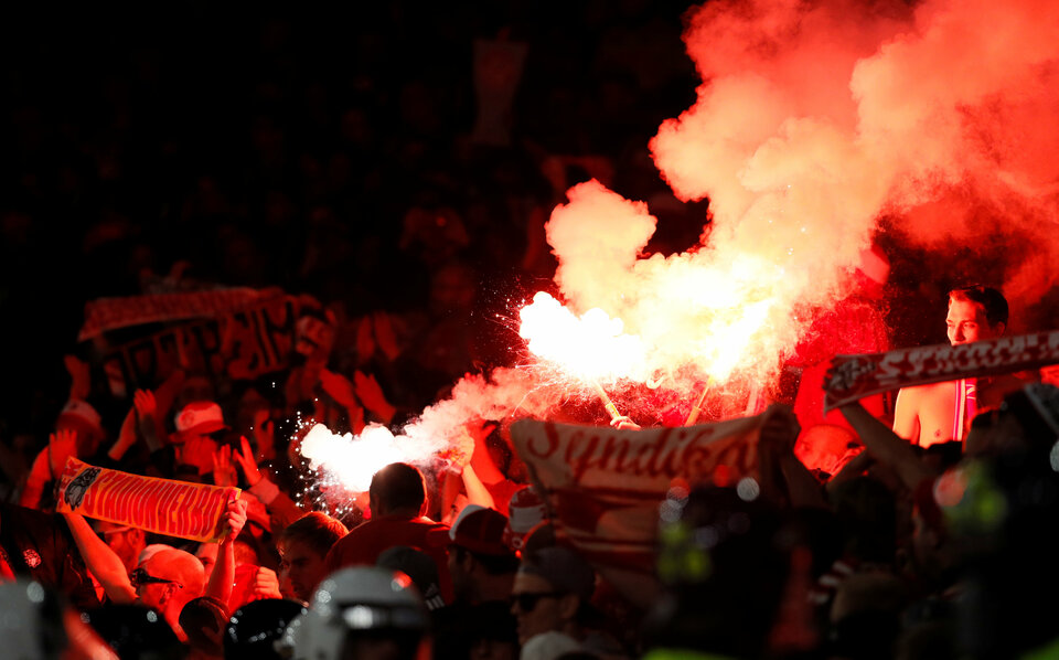 FC Cologne fans celebrate their first goal by letting off flares. (Reuters Photo/David Klein)