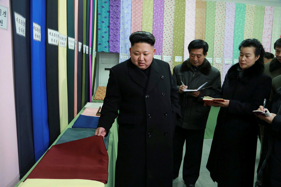 North Korean leader Kim Jong-u gives field guidance at the Kim Jong-suk Pyongyang Textile Mill in this undated photo released by the Korean Central News Agency (KCNA) in Pyongyang in December 2014.  (Reuters Photo/KCNA)