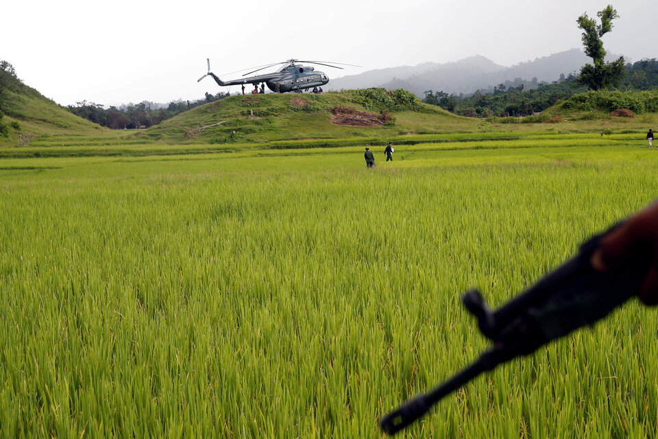 A Myanmar army helicopter is seen after transporting journalists to an area were government forces found the bodies of hindu villagers, whom authorities suspect were killed by insurgents last month, in a mass grave near Maungdaw in the north of Myanmar's Rakhine state, September 27, 2017.  (Reuters Photo)