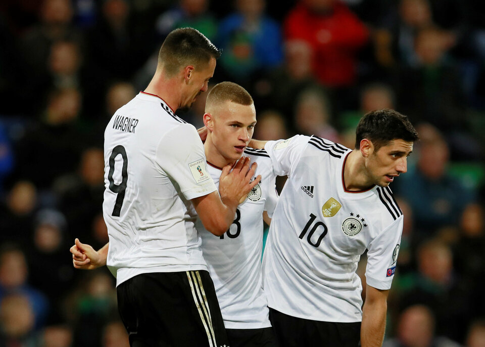 Germany’s Joshua Kimmich celebrates with Sandro Wagner and Lars Stindl after scoring their third goal. (Reuters Photo/Jason Cairnduff)