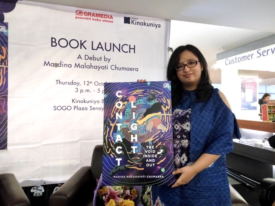 High-school student Madina Malahayati Chumaera launched her first poetry book on Thursday (12/10) at the Kinokuniya Bookstore at Plaza Senayan in Central Jakarta. (JG Photo/Dhania Sarahtika)