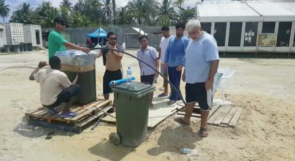 Asylum seekers modify a man-made well at a detention center on Manus Island, Papua New Guinea, in this still image taken from social media video November 3, 2017.  (Reuters Photo/Abdul Aziz Adam)