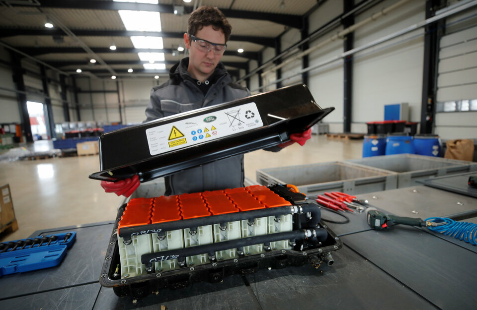 A used Land Rover lithium-ion car battery is opened before its dismantling by an employee of recycling firm Accurec in Krefeld, Germany, on Thursday (16/11). (Reuters Photo/Wolfgang Rattay)