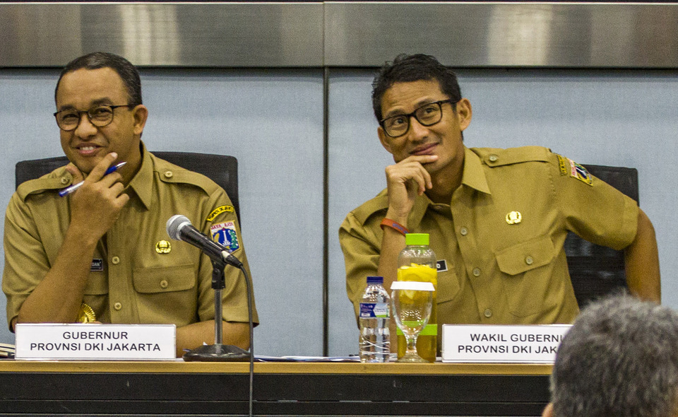 Jakarta deputy governor Sandiaga Uno, right, with Jakarta governor Anies Baswedan. (Antara Photo/Galih Pradipta)