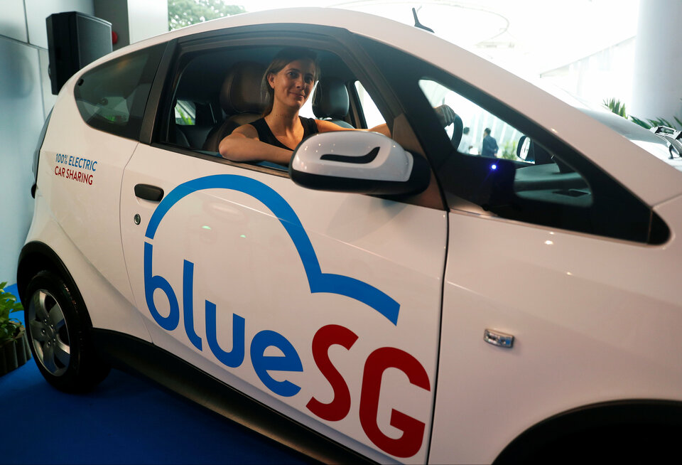 Marie Bollore, managing director of Blue Solutions poses in a BlueSG electric car-sharing vehicle during their launch in Singapore December 12, 2017. (Reuters Photo/Edgar Su)