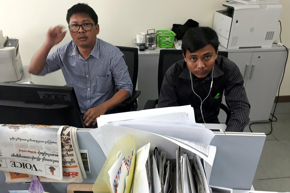 Reuters journalists Wa Lone (L) and Kyaw Soe Oo, who are based in Myanmar, pose for a picture at the Reuters office in Yangon, Myanmar December 11, 2017. Picture taken December 11, 2017. (Reuters Photo/Antoni Slodkowski)