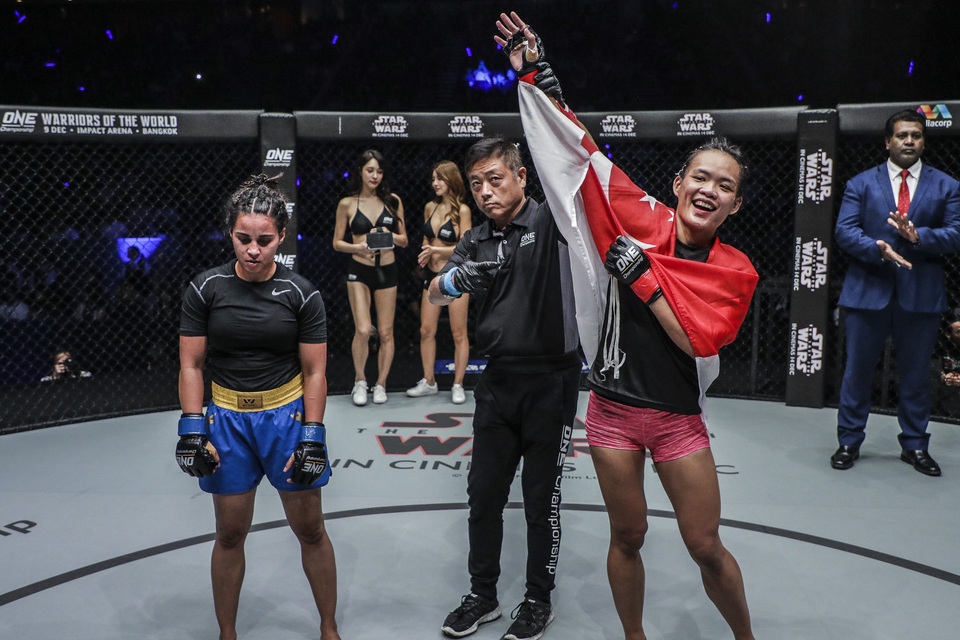 Singaporean fighter Tiffany Teo (right) after winning a ONE Championship match in Singapore. (ONE Championship Photo)