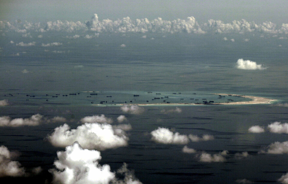 While the Pentagon plays down patrols close to Chinese-controlled reefs and islands in the South China Sea, Beijing is sounding the alarm about them, seeking to justify what experts say will be an even greater presence in the disputed region.  (Reuters Photo/Ritchie B. Tongo)