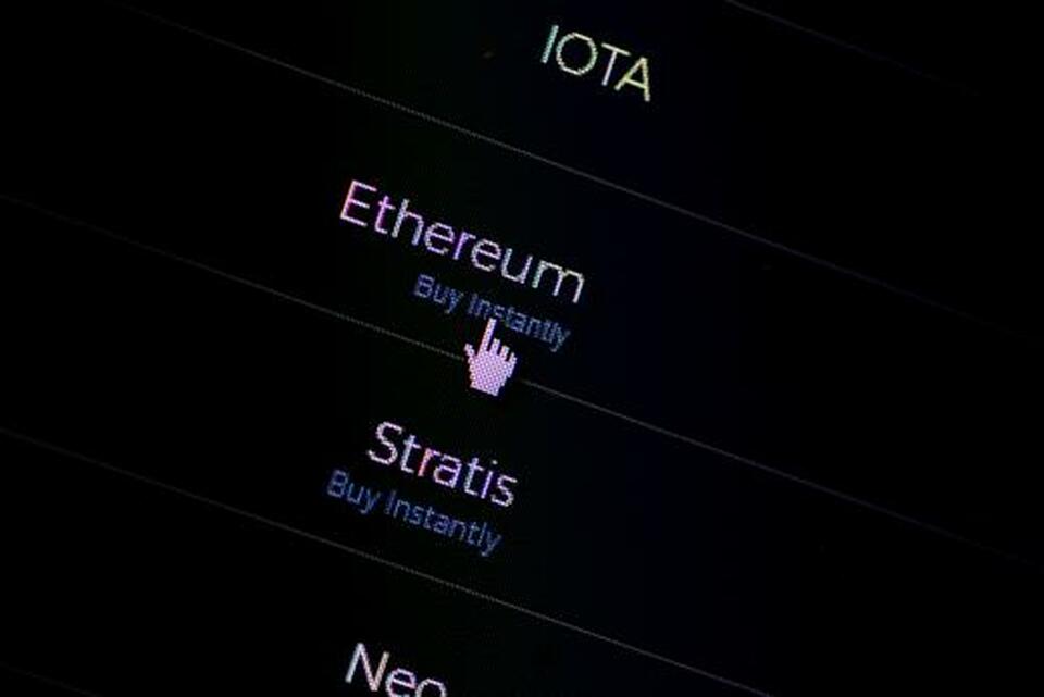 A list of cryptocurrencies on a website that tracks the value of initial coin offerings. (Reuters Photo/Thomas White)