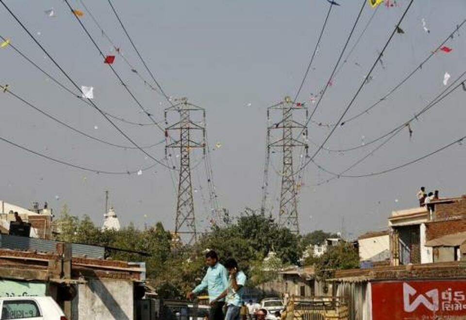 Electric power cables tangled up by kites are seen on the outskirts of Ahmedabad, India, in this January 2016 file photo. (Reuters Photo/Amit Dave)
