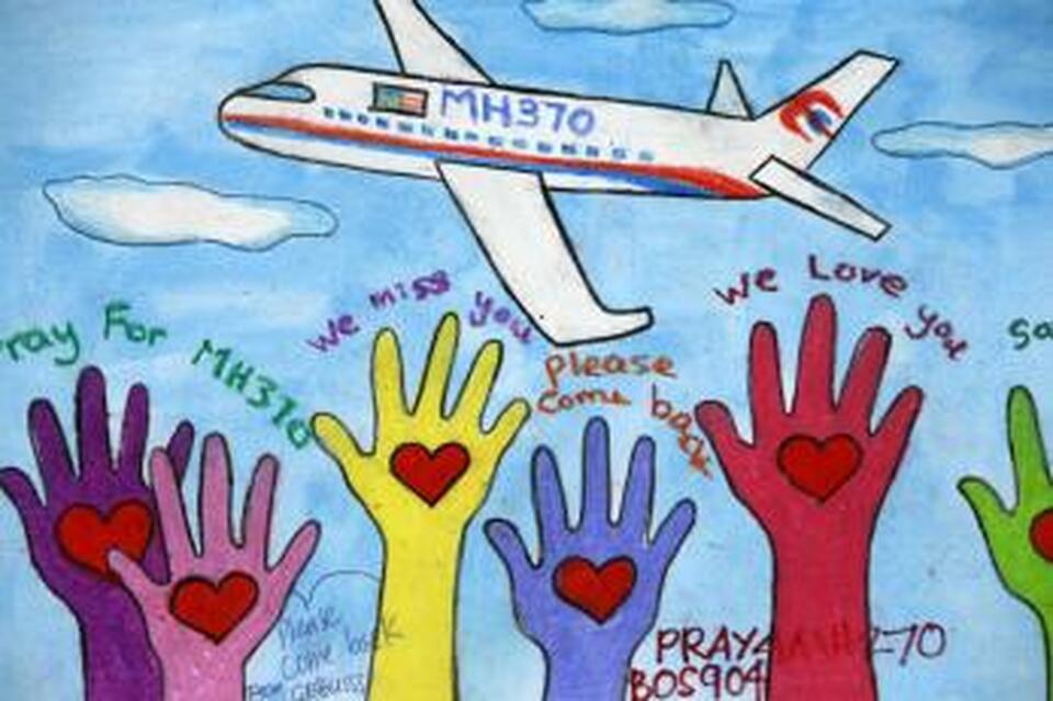 An artwork conveying well-wishes for the passengers and crew of MH370 is seen at a viewing gallery in Kuala Lumpur International Airport March 19, 2014.  (Reuters Photo/Edgar Su)