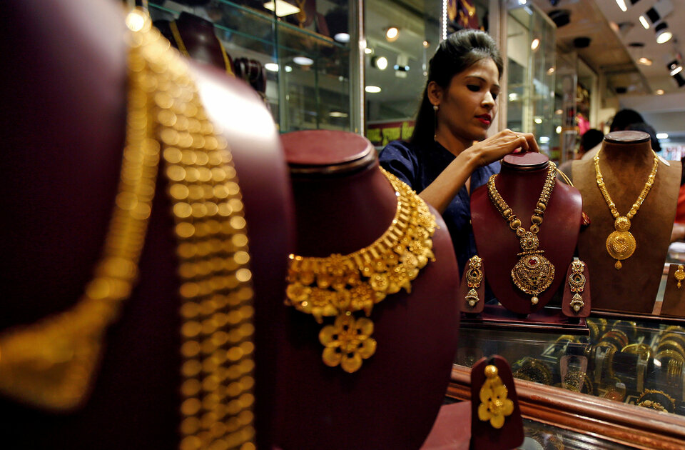 Demand for physical gold improved this week in India as jewelers resumed purchases after the government kept import taxes on the precious metal unchanged, while buying remained subdued in most other centers in Asia. (Reuters Photo/Shailesh Andrade)