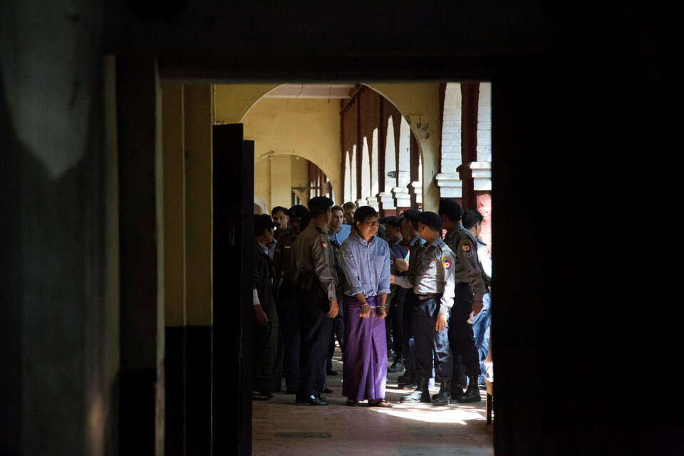 Detained Reuters journalist Wa Lone is escorted by police after a court hearing in Yangon, Myanmar Feb. 1. (Reuters Photo/Ann Wang)
