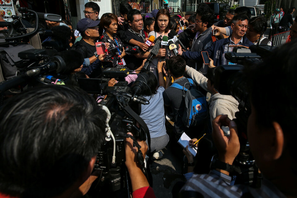 Nuttaa Mahattana, a television reporter and activist speaks, to media in front of the Maneeya Center building where the Foreign Correspondents Club of Thailand (FCCT) is located, in Bangkok, Thailand, Tuesday (06/02). (Reuters Photo/Athit Perawongmetha)
