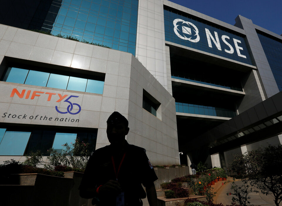 A guard walks past the National Stock Exchange (NSE) building in Mumbai in this Feb. 9, 2018 file photo. (Reuters Photo/Danish Siddiqui)