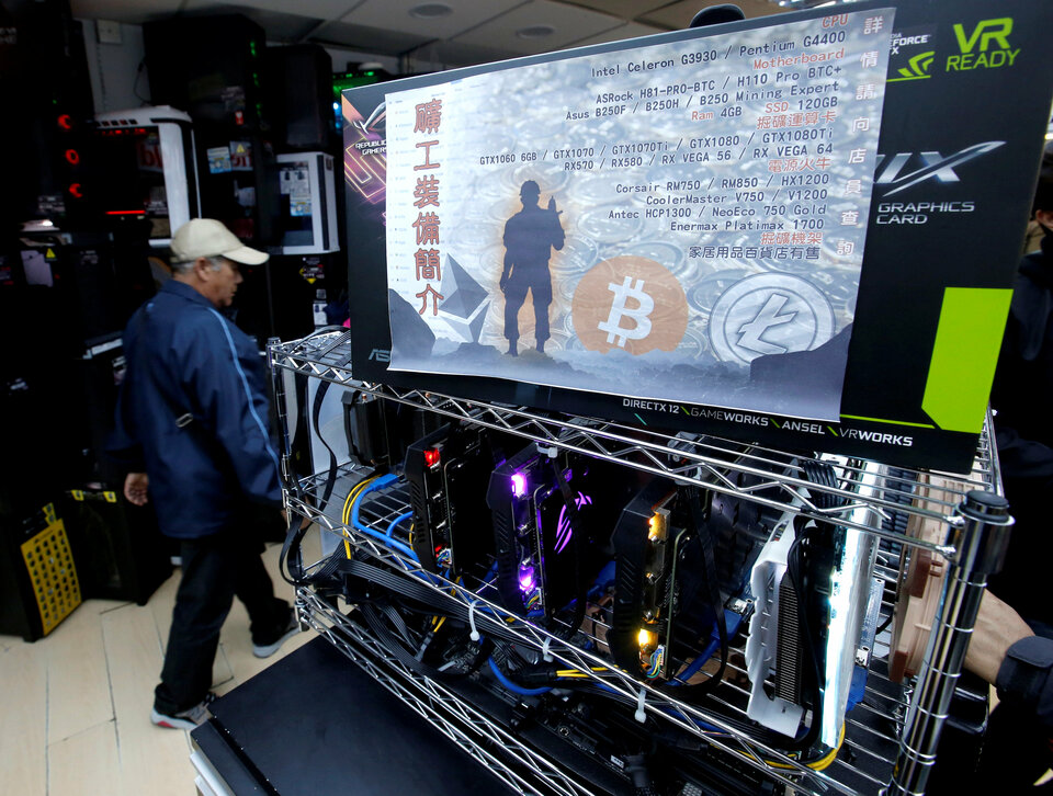 A cryptocurrency mining computer equipped with high-end graphic cards is seen on display at a computer mall in Hong Kong on Jan. 29, 2018. (Reuters Photo/Bobby Yip)