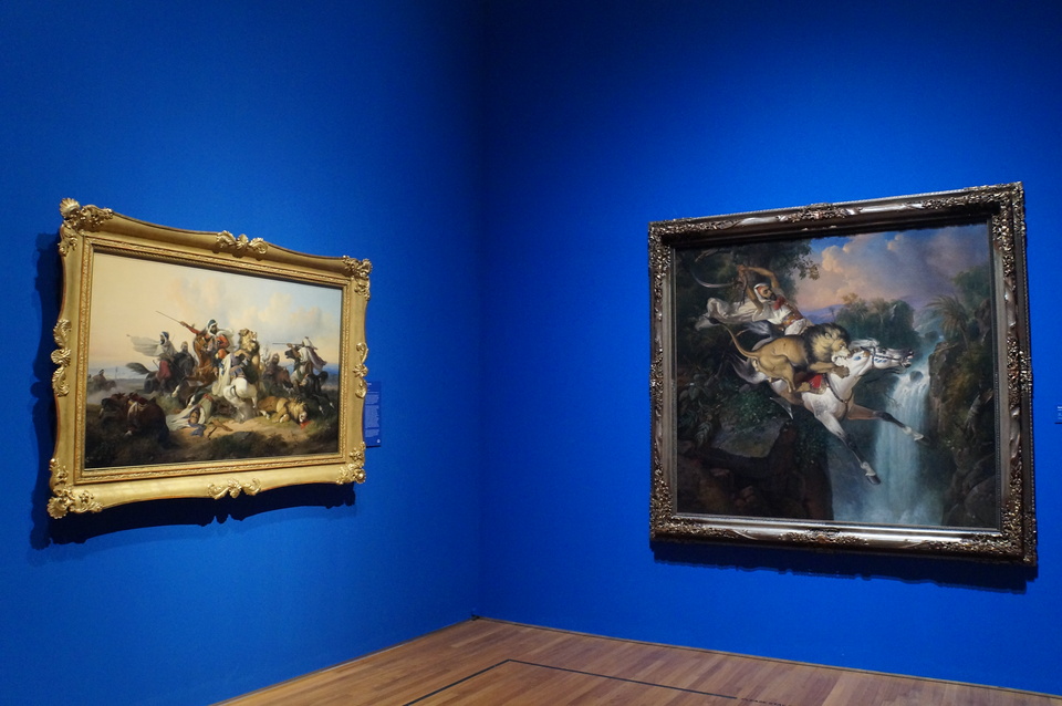 'Lion Hunt' and 'Arab Horseman Attacked by a Lion' by Raden Saleh at National Gallery Singapore's 'Between Worlds: Raden Saleh and Juan Luna' exhibition, on until March 11. (JG Photo/Dhania Sarahtika)