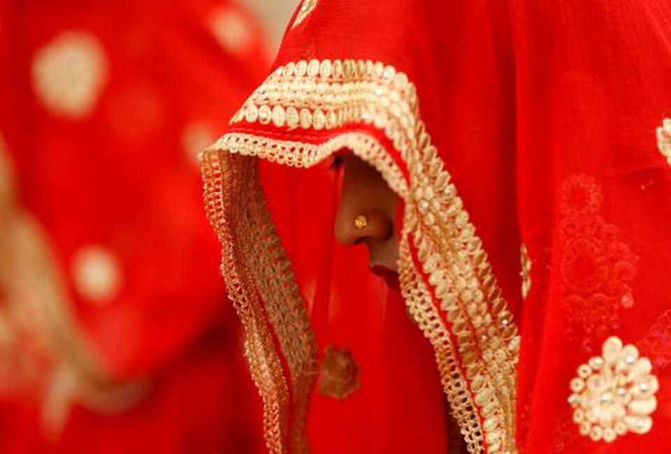 A bride waits to take her wedding vows during a mass marriage ceremony in Ahmedabad, India, on Jan. 11. (Reuters Photo/Amit Dave)