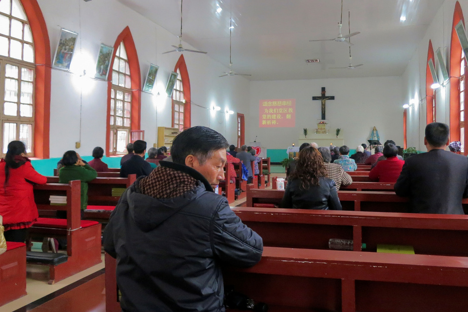 Liu Ande, 62, prays during a Sunday mass at the official Catholic church in Yingtan, Jiangxi province, March 25. (Reuters Photo/James Pomfret)
