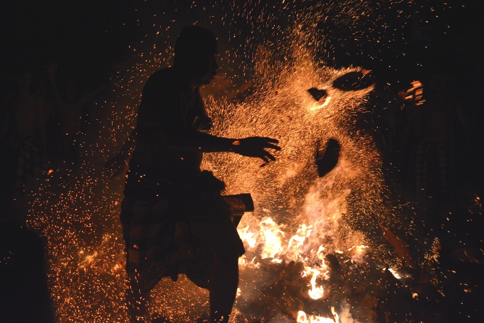 Men throw blazing coconut husks on each other during Mesabatan Api, or 'the war of fire,' in Nagi Village, Gianyar, Bali, on Friday, March 16, 2018. The ritual is held ahead of other Balinese New Year celebrations on the Day of Nyepi to purify and strengthen communal and fraternal bonds. (Antara Photo/Wira Suryantala)