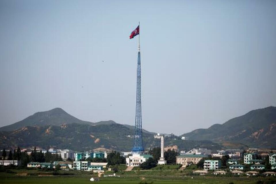 A North Korean flag flutters on top of a tower at the propaganda village of Gijungdong in North Korea, in this picture taken near the truce village of Panmunjom, South Korea. (Reuters Photo/Kim Hong-ji)