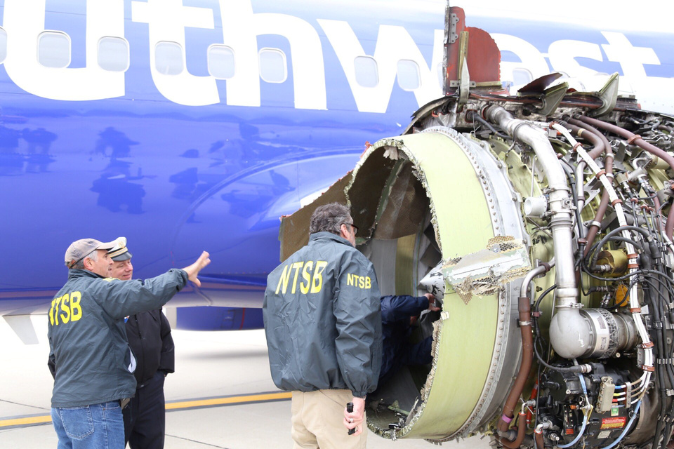 Investigators examining damage to the engine of a Southwest Airlines plane in this image released from Philadelphia, Pennsylvania, on Tuesday (17/04). (Reuters Photo/NTSB)