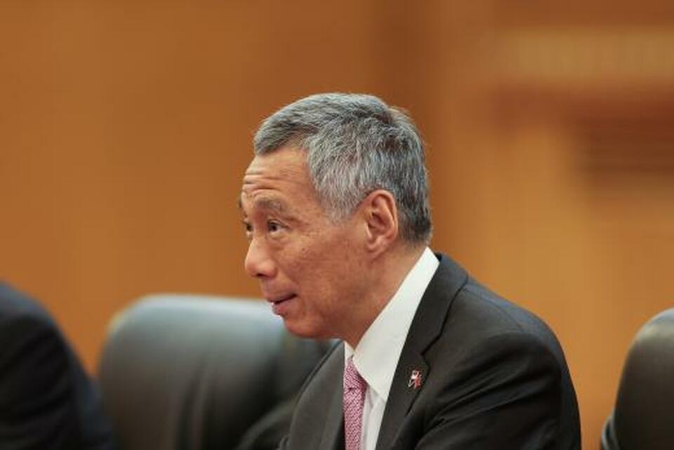 Singapore Prime Minister Lee Hsien Loong reshuffled his cabinet on Tuesday (24/04), naming one of his potential successors, Chan Chun Sing, as trade minister and giving additional duties to two other ministers tipped as contenders. (Reuters Photo/Lintao Zhang)