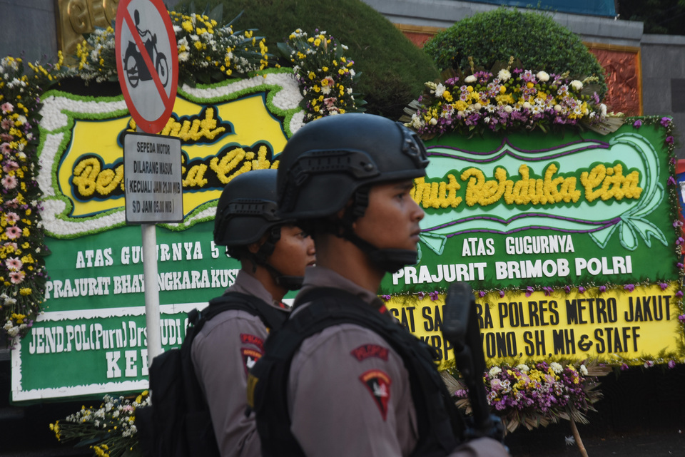 Wreaths line the front of the Brimob prison in Depok, West Java, after prisoners killed five police officers in a riot.  (Antara Photo/Indrianto Eko Suwarso)

