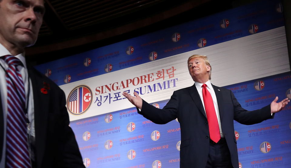 US President Donald Trump reacts after a news conference after his meeting with North Korean leader Kim Jong-un at the Capella Hotel on Sentosa island in Singapore, Tuesday (12/06). (Reuters Photo/Jonathan Ernst)