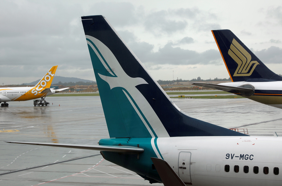 SilkAir, Singapore Airlines and Scoot planes sit on the tarmac at Changi Airport in Singapore. (Reuters Photo/Edgar Su)