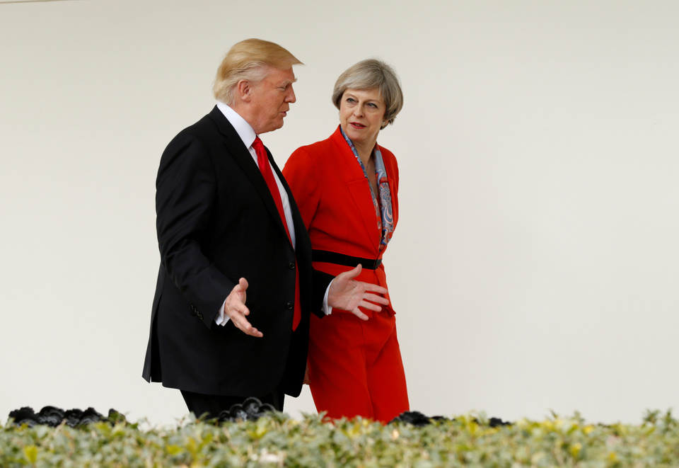US President Donald Trump escorts British Prime Minister Theresa May down the White House colonnade after their meeting at the White House in Washington, US. (Reuters Photo/Kevin Lamarque)
