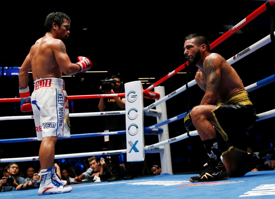 Manny Pacquiao of the Philippines in action against Lucas Matthysse of Argentina in their WBA welterweight title fight in Axiata Arena, Kuala Lumpur, on Sunday (15/07). (Reuters Photo/Lai Seng Sin)