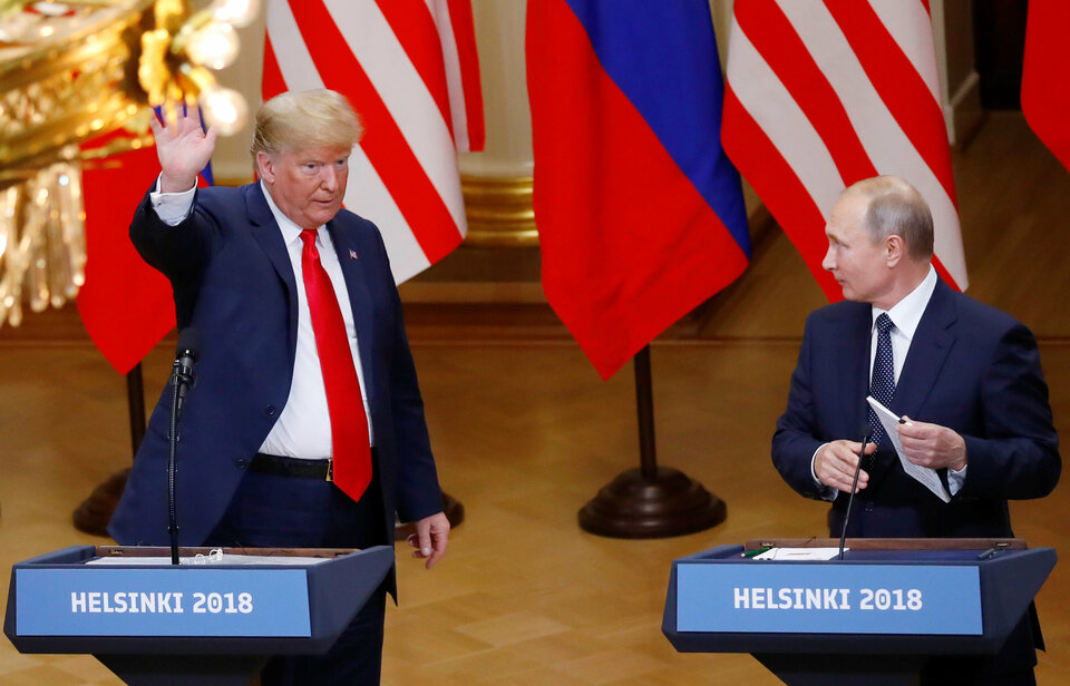 US President Donald Trump and Russian President Vladimir Putin react at the end of the joint news conference after their meeting in Helsinki, Finland, Monday (16/07). (Reuters Photo/Leonhard Foeger)