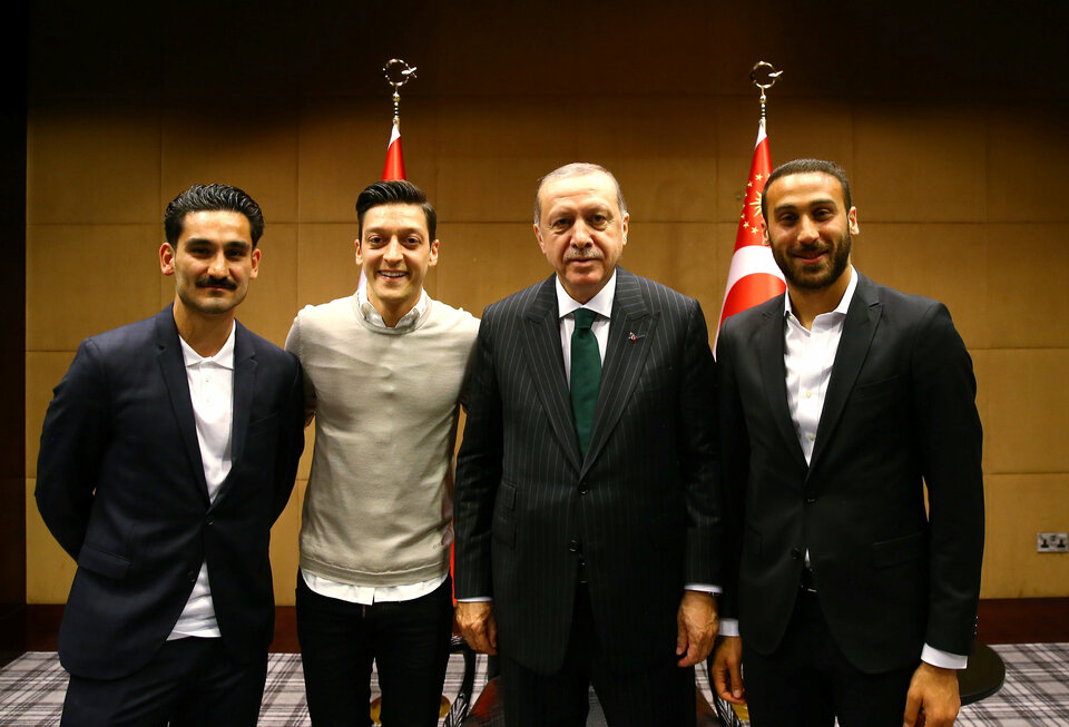 Turkish President Tayyip Erdogan meets with Premier League star players in May including Mesut Ozil, second from left. (Photo courtesy of Turkish Presidential Palace/Kayhan Ozer/Via Reuters)