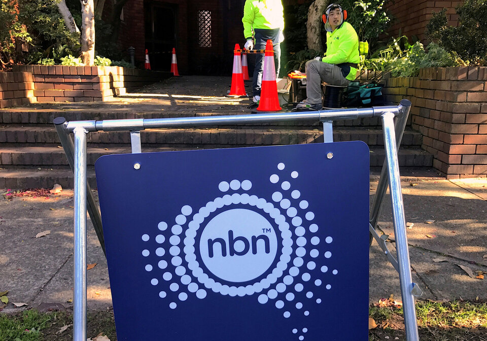 Workers install cables for the Australian National Broadband Network at an apartment block in Sydney in the May 30, 2017 file photo. (Reuters Photo/David Gray)