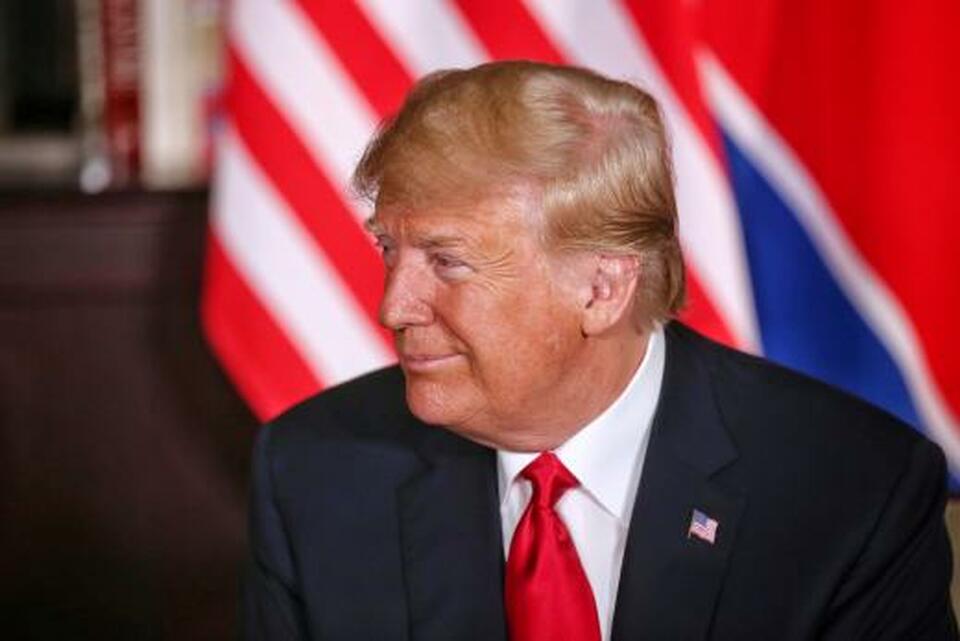 US President Donald Trump smiles next to North Korean leader Kim Jong-un (not pictured) at the Capella Hotel on Sentosa island in Singapore, June 12. (Reuters Photo/Kevin Lim)