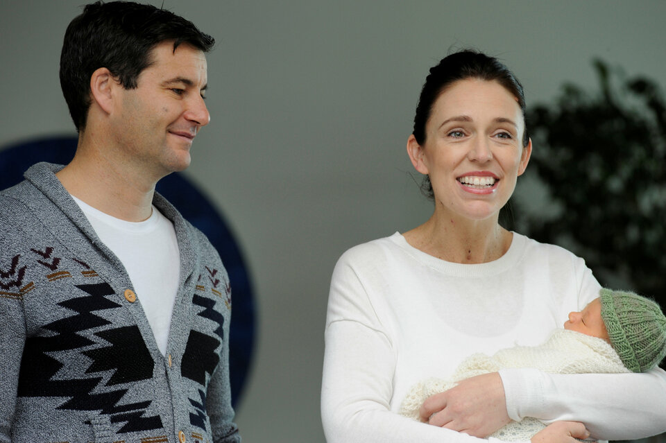 New Zealand Prime Minister Jacinda Ardern carries her newborn baby Neve Te Aroha Ardern Gayford with her partner Clarke Gayford as she walks out of the Auckland Hospital in New Zealand, June 24. (Reuters Photo/Ross Land)