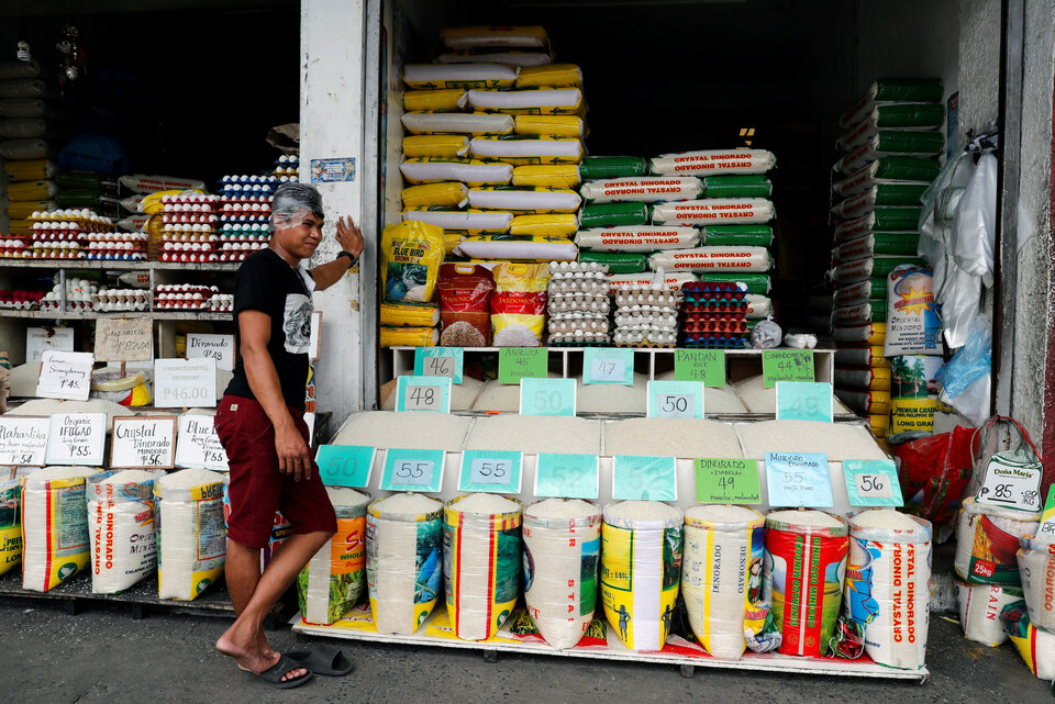 A vendor waits for customers at a rice and egg shop in Paranaque, Metro Manila, Philippines, Aug. 7. (Reuters Photo/Erik De Castro)