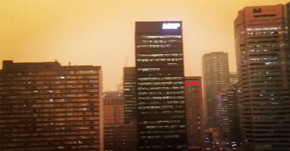 The skyline of Edmonton in Canada is shrouded in an orange haze in as smoke continue to drift over from the British Columbia wildfires on Aug. 15, 2018, in this still image taken from a video obtained from social media. (Reuters Photo/Jay Cyluck)