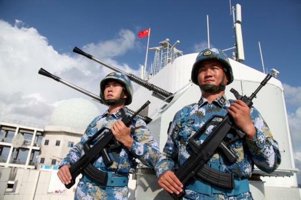 Soldiers of China's People's Liberation Army (PLA) Navy stand guard in the Spratly Islands. (Reuters Photo)