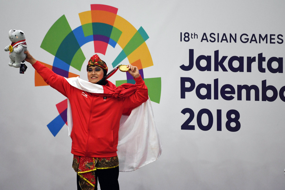 Puspa Arumsari secured Indonesia's 13th gold medal at the 2018 Asian Games on Monday (27/08). (Antara Photo/Inasgoc/Melvinas Priananda)
