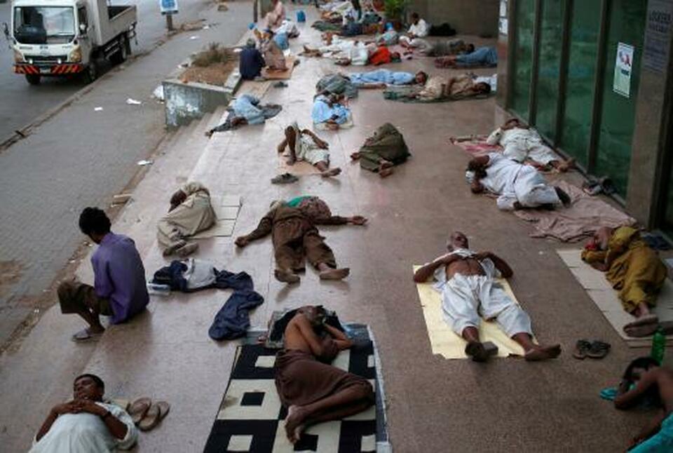 Residents sleep on a building pavement, to escape heat and frequent power outage in their residence area Karachi, Pakistan. A heatwave has killed dozens in Pakistan's southern city of Karachi, amid fears the death toll could climb as the high temperatures persist.
(Reuters Photo/Akhtar Soomro)